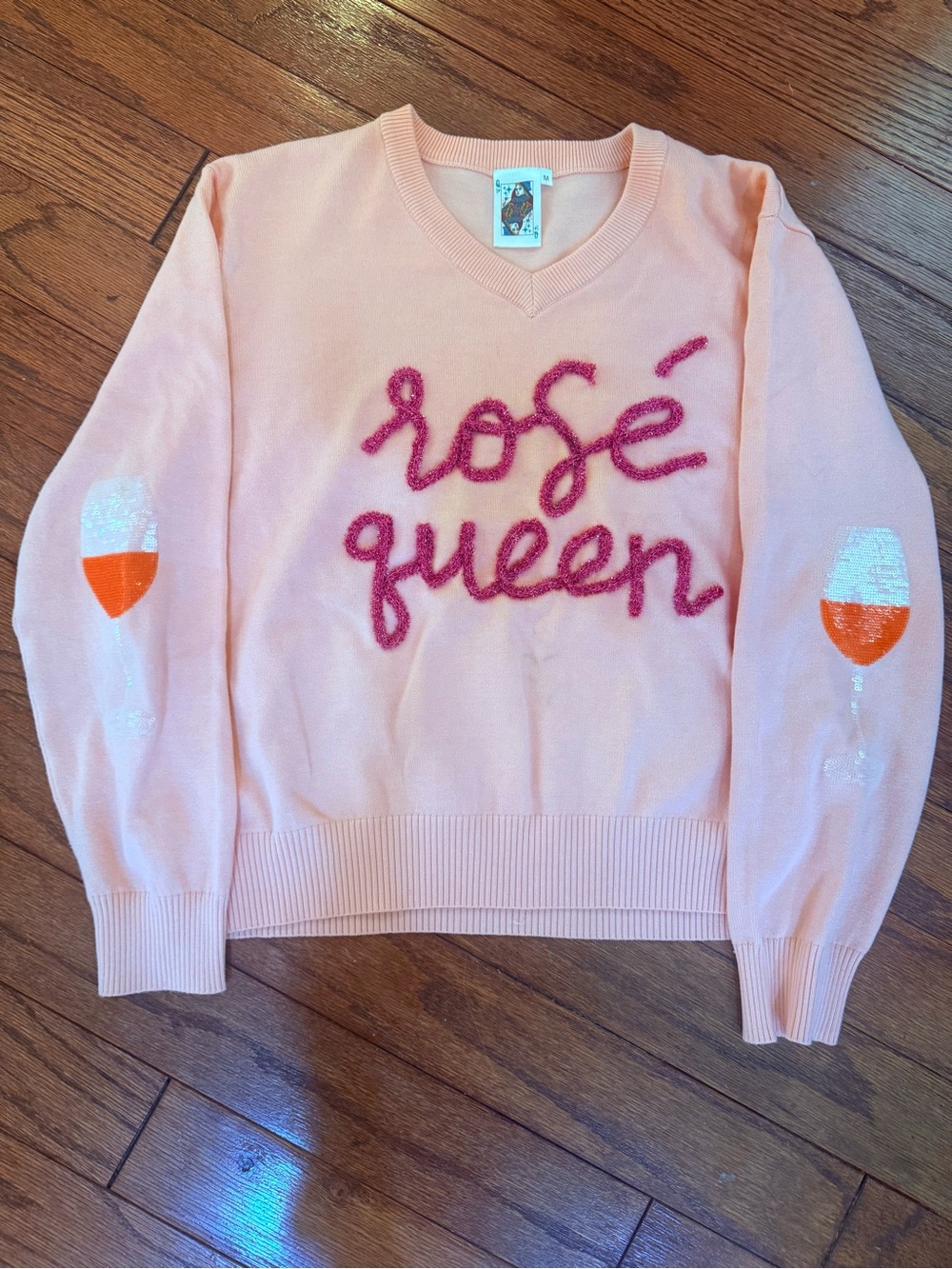 QUEEN OF SPARKLES Pink V-Neck 'rosé queen' Sweater with Orange Sequin Glasses